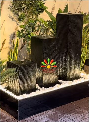 Fontaine contemporaine noire à plantes